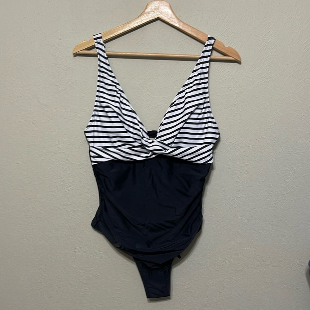 NWT! One piece swimsuit, V-neck criss cross design in black-and-white, size M